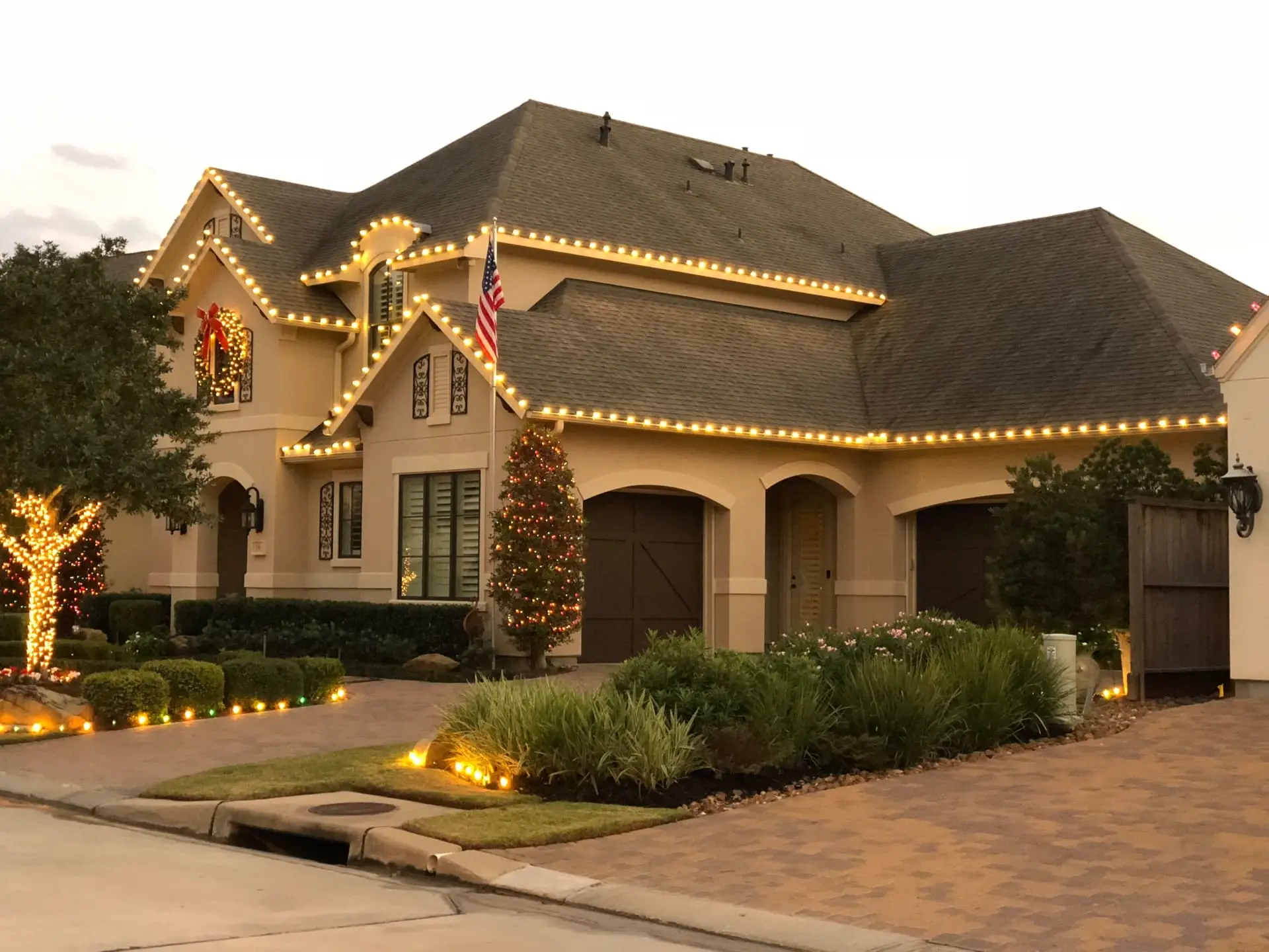 Roofline, tree wrapping, and pathway accents