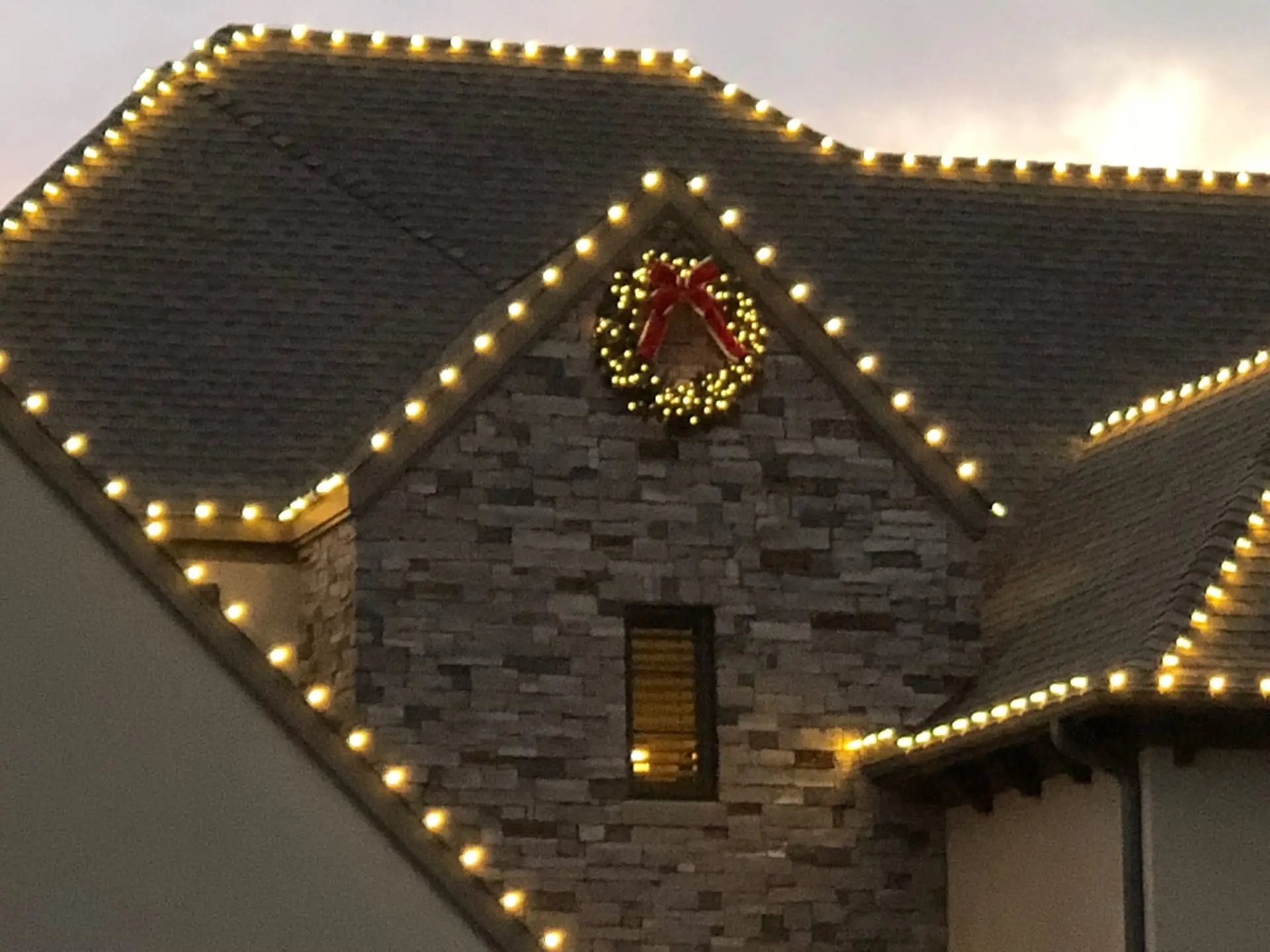 Roofline detail. Warm white wreath