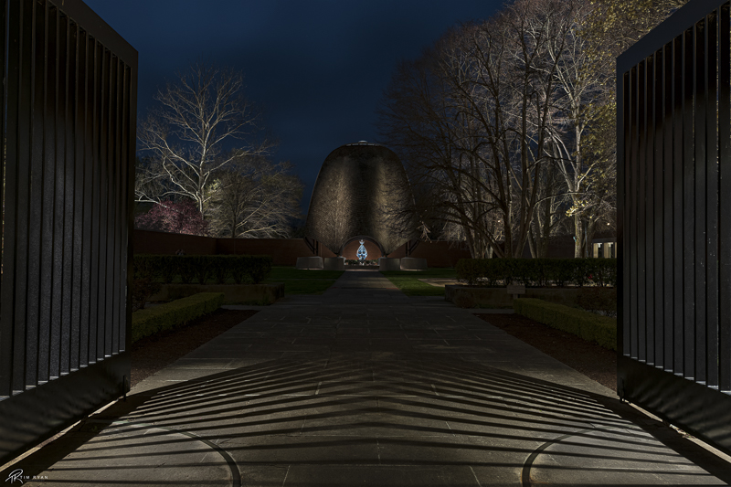 The Lipchitz gilded gate framing the Roofless Church baldachin