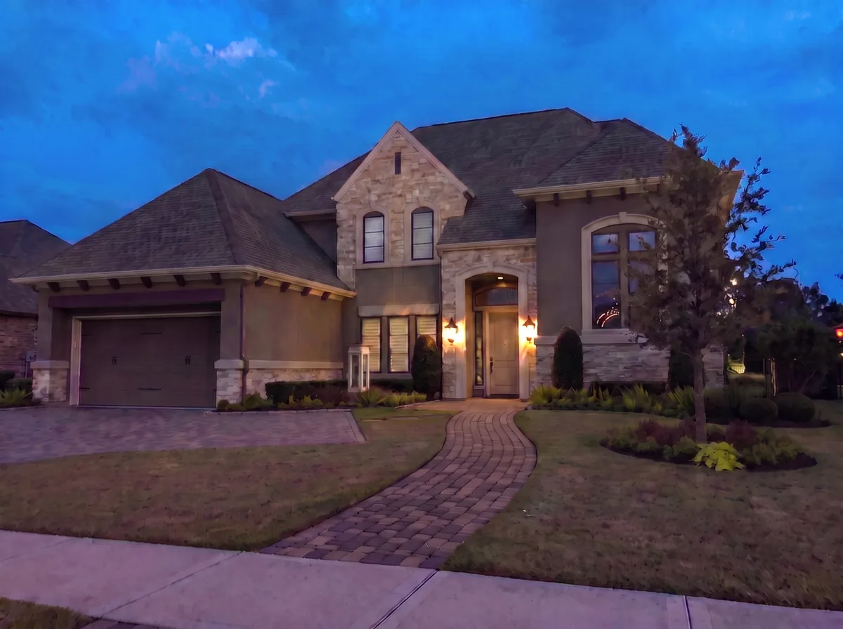 A Houston home at dusk, before any Christmas lights